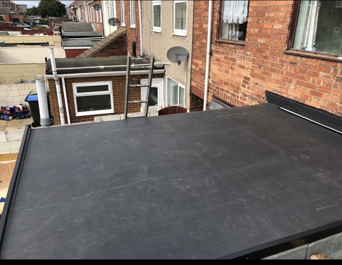 A new black rubber flat roof on a rear extension
